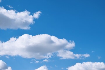 Beautiful large puffy white clouds in the bright blue sky