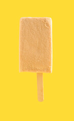 a fresh milk tea flavor popsicle on yellow background