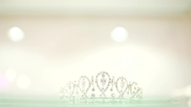 Close up view on incredible diadem beautiful sparkling tiara wonderful head jewelry crown on white background
