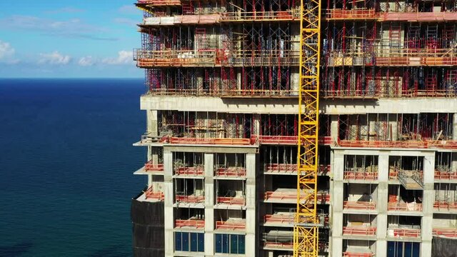 Drone footage inspecting a highrise building under construction 4k