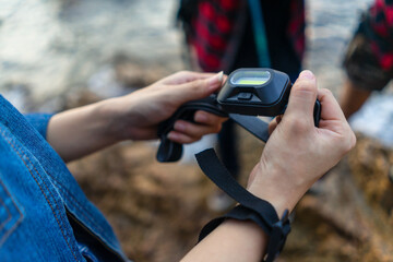 Fototapeta premium Hikers along with lights portable illumination. Nighttime travel. Equipment for traveling at night.