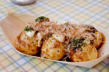 Close up Tapanese Takoyaki Octopus ball with fish flake on top