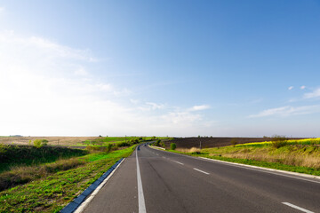 speed highway through the field. asphalt-paved road