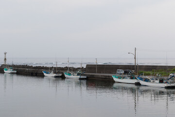 Fishing boats in Japan at the port, Japanese fishing vessels in a marina. Boats at the dock.
