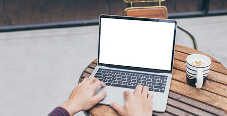 computer mockup image blank screen.hand woman work using laptop with white background for advertising,contact business search information on desk at coffee shop.marketing and creative design