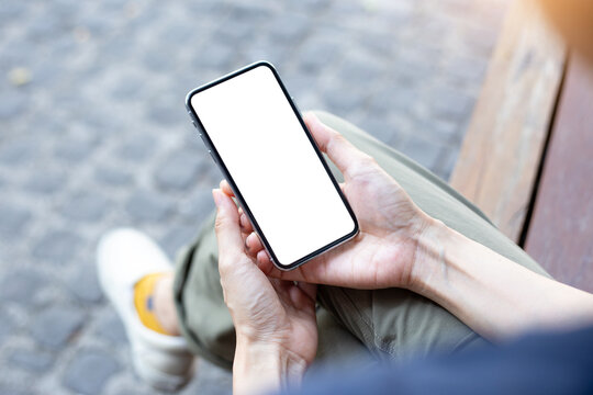cell phone mockup image blank white screen.woman hand holding texting using mobile background empty space for advertise.work people contact marketing business,technology