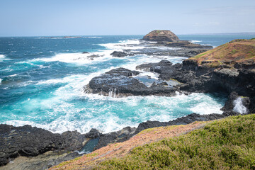 waves crashing on rocks