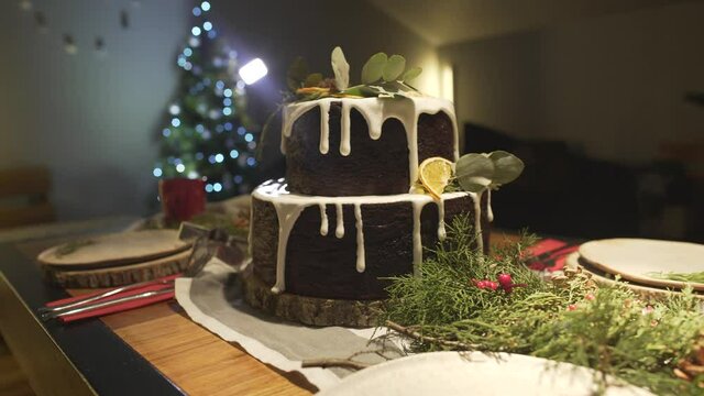 Close up shot of delicious gingerbread cake on Christmas dinner table decorated in festive New Year Eve Noel atmosphere