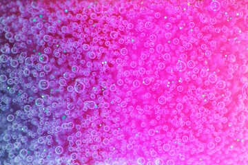 Pink and purple background with air bubbles. Slime concept.
