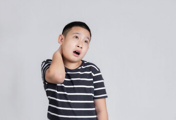 Asian boys studio portrait on gray background with looks shocked