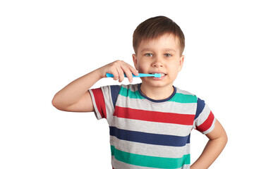 Smiling boy brushes his teeth and shows a thumbs up, isolated on a white background
