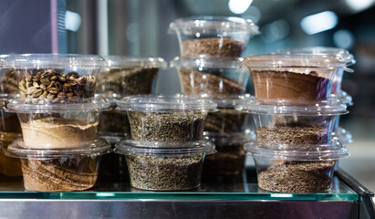 various spices and herbs packed in small transparent plastic boxes