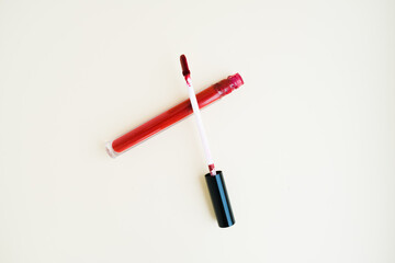liquid lipstick in a tube on a light background