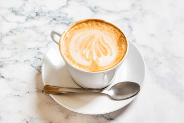 cup of cappuccino on the marble background