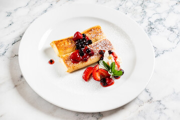 pancakes with strawberries and mint