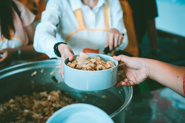 Poverty concept : Feeding the poor to hands of a beggar