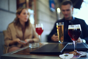 glasses of toast chin chin, hands with glasses of white wine in a street cafe