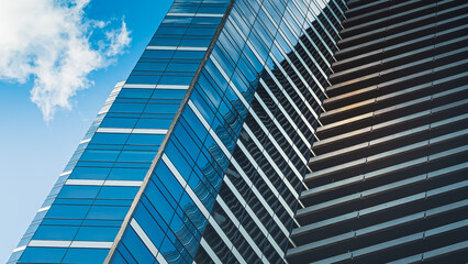 Detailed texture of windows and blue sky for financial or corporate purpose.