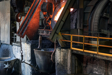 View of the big induction furnace and melting pot in foundry for smelting. The ores of base metals...