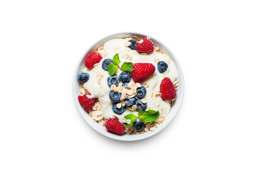 Breakfast, oatmeal with blueberry and raspberry on white bowl in the morning.