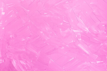 Cracked and textured pink wall, plaster background.