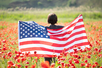 Patriot woman holding the american flag on the 4th of July