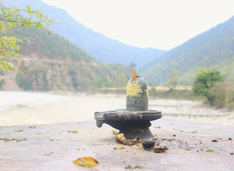 shiva linga in the river bank. this pic is taken in uttarakhand, india.