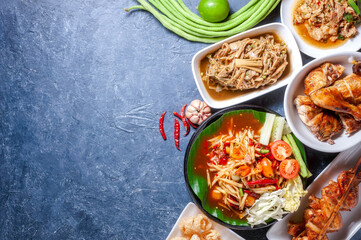 Green papaya salad with grilled chicken, slide grilled pork salad and spicy shredded bamboo shot salad. Thai northeast food.