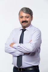 Good looking mature Indian male with business suit isolated on white background.