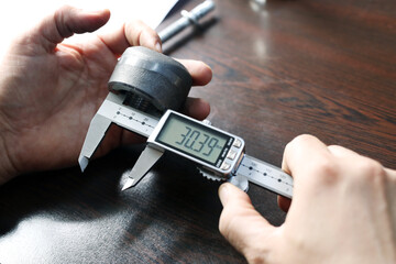 Internal diameter of weldolet measuring with the digital vernier caliper micrometer. A micrometer,...