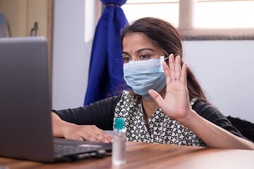 Sick Girl in medical mask talking or having chat with doctor on video conference - telehealth, telemedicine or tele counseling with Nurse or Doctor during coronavirus or covid-19 crisis.