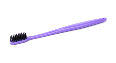 purple plastic toothbrush for personal hygiene, isolated on a white background