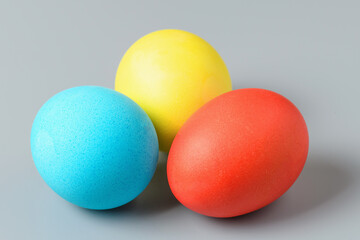 Colorful Easter eggs on a gray background. Easter eggs background. Easter eggs are a symbol and a mandatory attribute of the holiday.