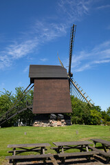 Old mill with blue sky in brown