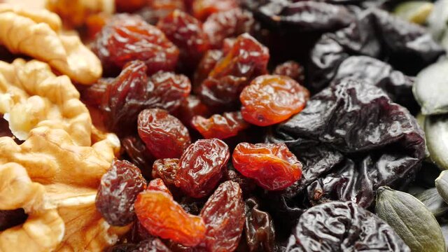 Close up of assorted dried fruits and nuts. Natural food background