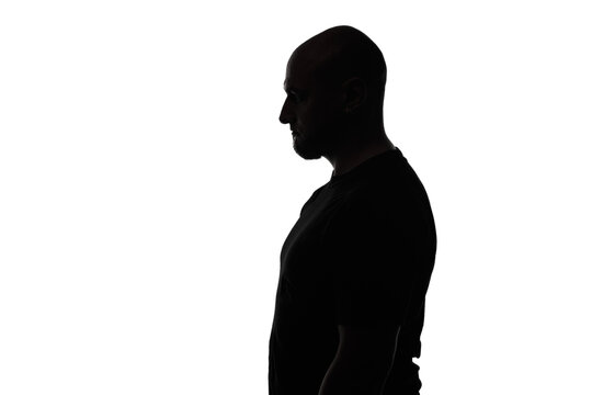 Silhouette Of Bald Man In Profile On White Background