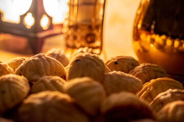 Eid sweets served with head scarf as background