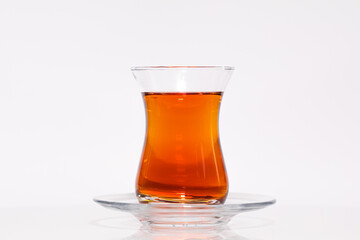 Fototapeta na wymiar A glass of Turkish tea isolated on white background. High-resolution photo.