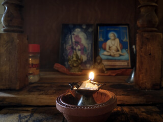 Lamp (diya) in front of god