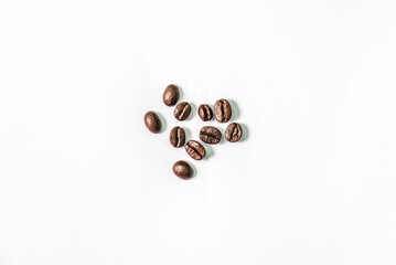 Closeup shot of coffee beans on white background. Seed nature from above view. Group agriculture grain arabica. Photos from the top view.