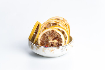 large number of dried lemon slices on a white background. vitamin fruit food