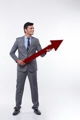 Businessmen holding red arrow sing 