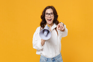 Cheerful young business woman in white shirt glasses isolated on yellow background. Achievement...