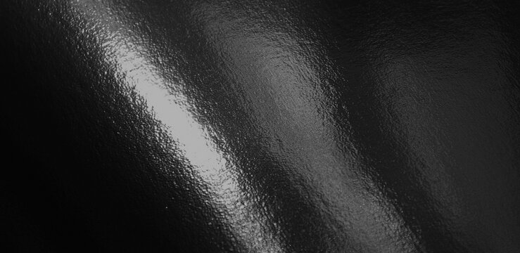 Black foil gradient texture background with uneven surface