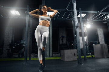 Fitnesswoman posing in gym.
