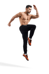 Fototapeta na wymiar Shirtless bodybuilder jumping in place.