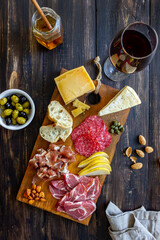Wine snack. Prosciutto, Parma ham, salami, almonds, olives, baguette, blue cheese, parmesan....