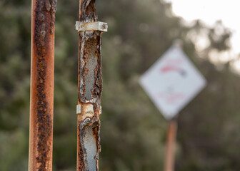 corroded sign posts on Tannum Sands beach, Gladstone Region, Queensland