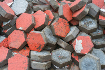 Pile of dyed red cubes for making outdoor pavement tiles