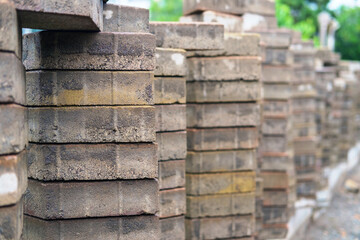 A pile of gray dirty paving tiles